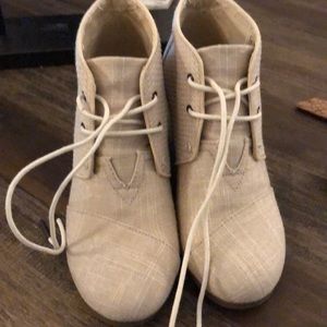 Toms wedged shoes. They say they’re a size 8